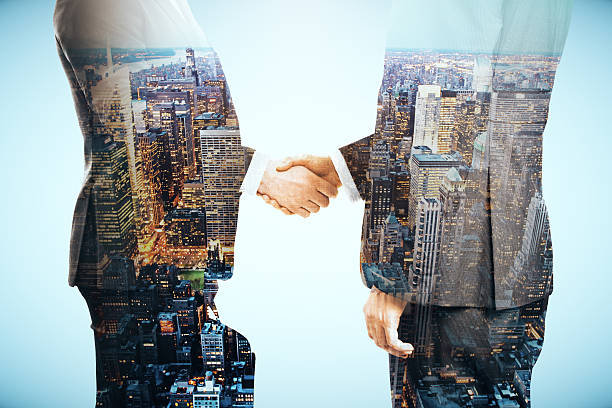 istock Businessmen shaking hands 607501336