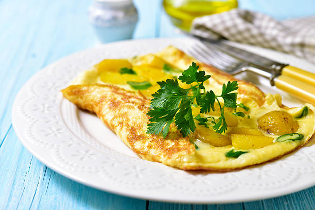 istock Omelet stuffed with potato and cheese. 607501600