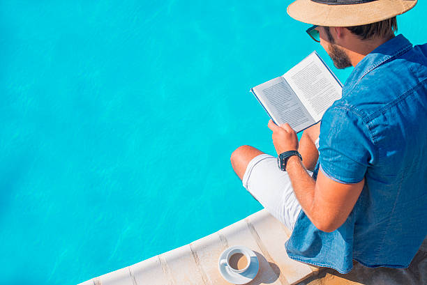 istock close up of a man reading a book 607501642