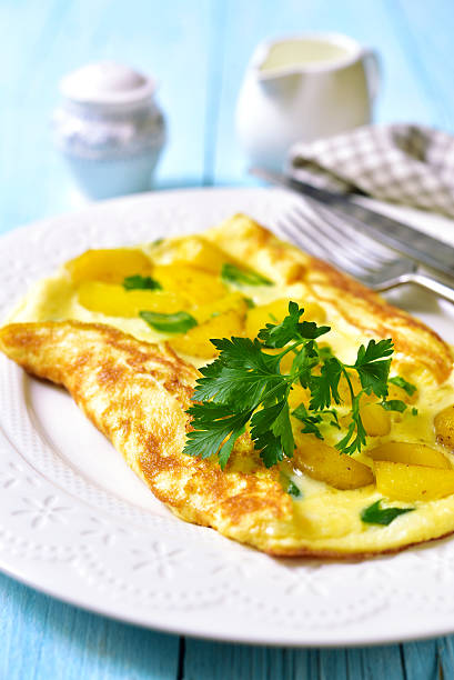 istock Omelet stuffed with potato and cheese. 607501796