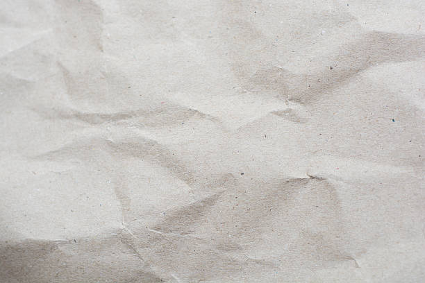 istock crumpled cream color tone paper pattern texture background 607502072