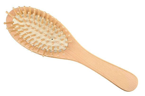 Wooden hairbrush isolated on white background stock photo
