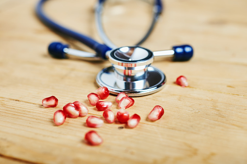 stethoscope and pomegranate seeds