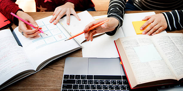 istock Women Friendship Studying Brainstorming Technology Concept 607506542
