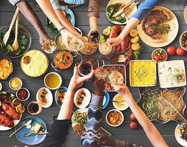 istock Friends Happiness Enjoying Dinning Eating Concept 607507534