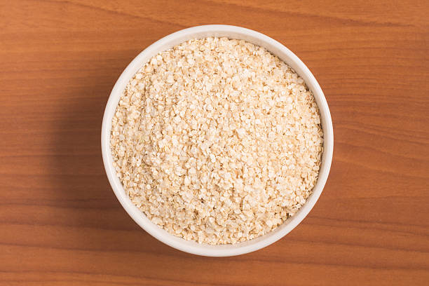 istock Quinoa Flakes into a bowl. Super Food. 607508154