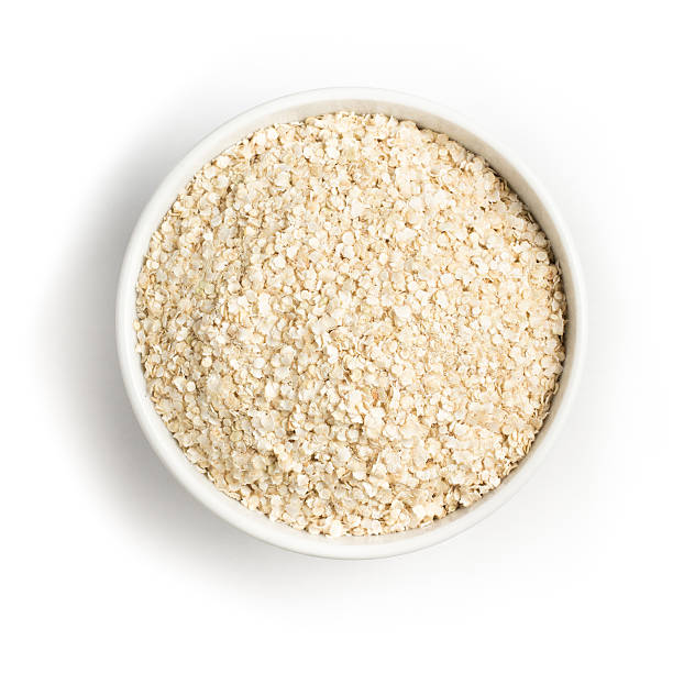 istock Quinoa Flakes into a bowl. Super Food. 607508370