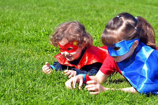 istock Superhero sisters play outdoors. 607508508
