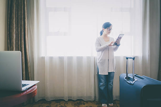 istock Businesswoman work at hotel room 607508830