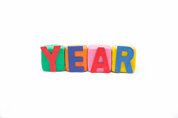 istock word Year by wooden letter on clay 607508852