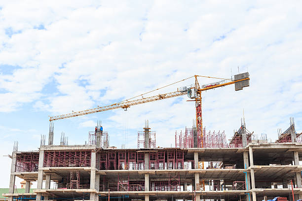 istock Big construction crane and the building against the sky 607587374