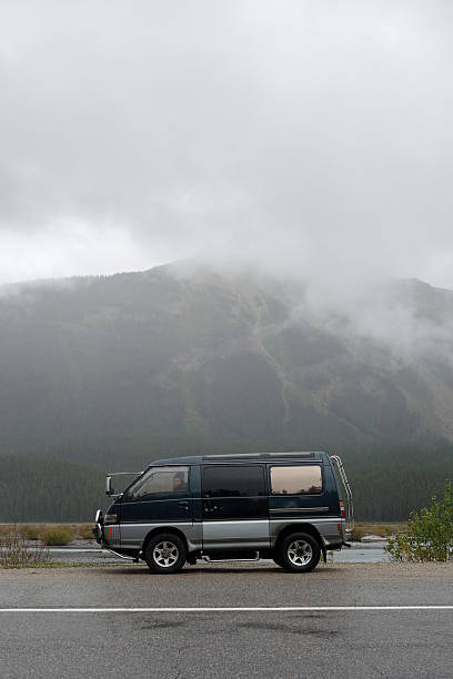 istock Camper van road trip in the misty mountains 607589438