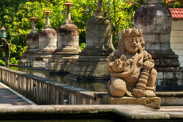 istock Statues and stupas of Mendut temple 607589552