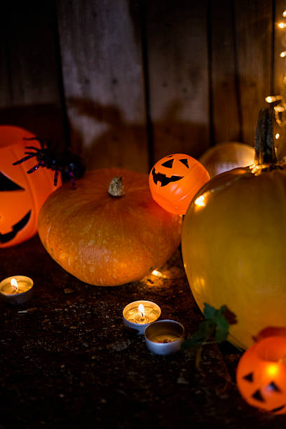 istock Halloween pumpkin head jack lantern on wooden background 607590382
