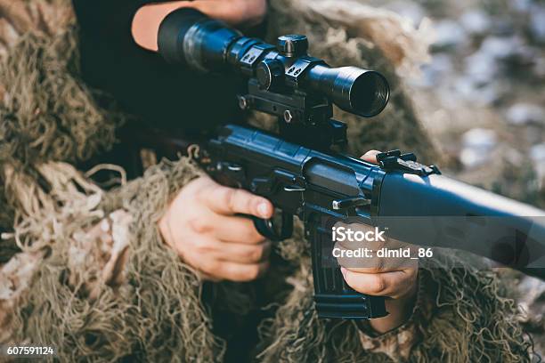 Soldier In Camouflage With A Sniper Rifle Stock Photo - Download Image Now - Aggression, Airsoft Gun, Ammunition