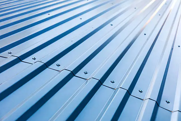 Photo of blue corrugated metal roof with rivets