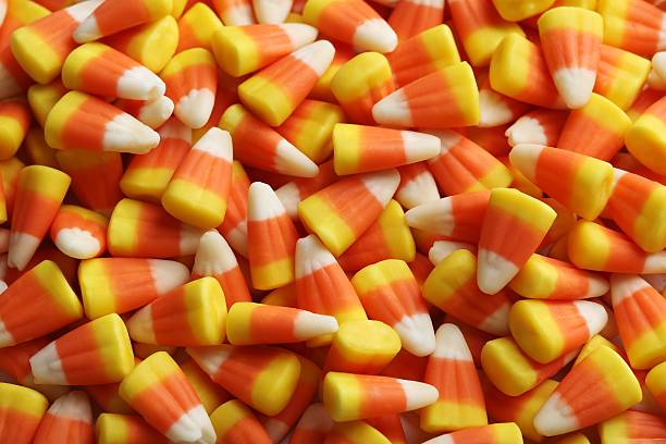 istock Halloween candy corns background, close up 607594916