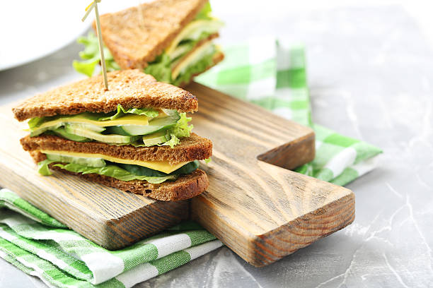istock Tasty and fresh sandwiches on a grey table 607595512