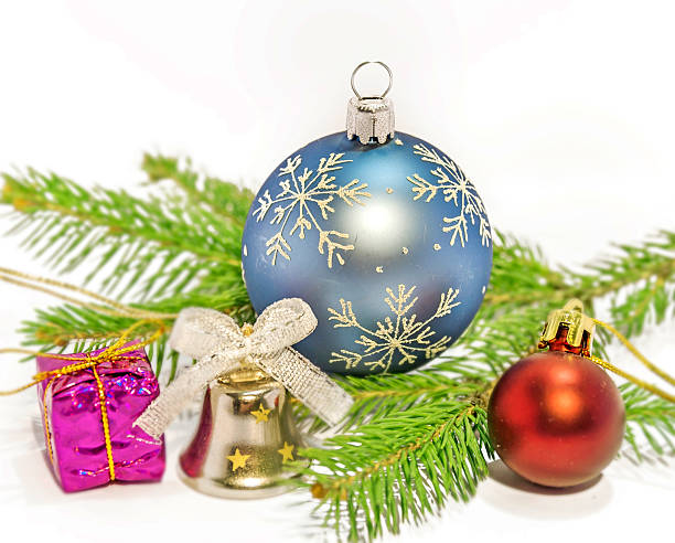 istock Several christmas decoration on green pine tree on white background 607596712