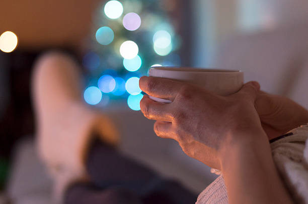 istock Woman at home drinking tea. It's Christmas 607597734