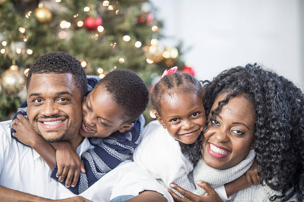 istock Family Sitting by the Christmas Tree 607597922