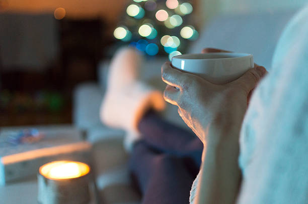 istock Woman at home drinking tea. It's Christmas 607598010
