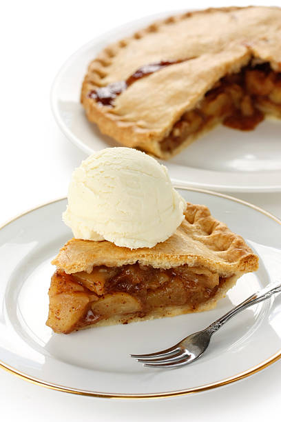 istock homemade apple pie with ice cream 607602574