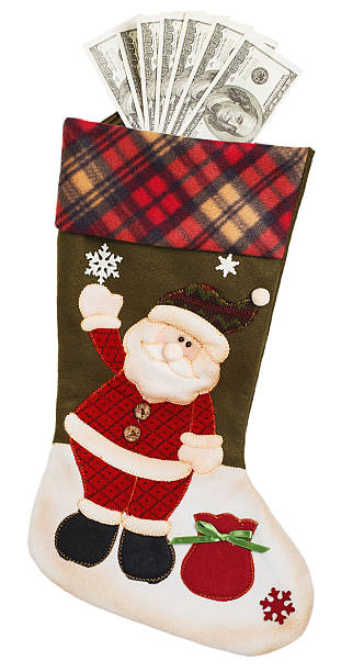 istock Dollars in green and white stocking with Santa Claus 607603990