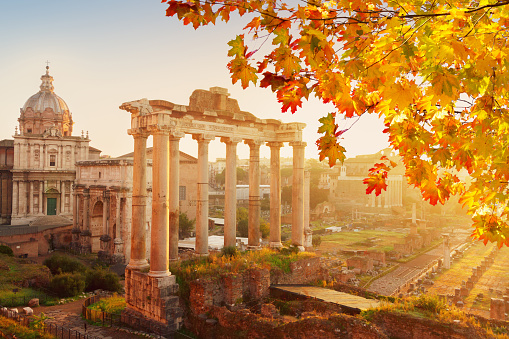 Forum - Roman ruins with cityscape of Rome with sunrire light at fall day, Italy
