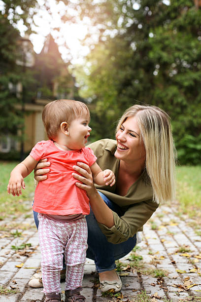 istock Baby girl learning walking. 607605098
