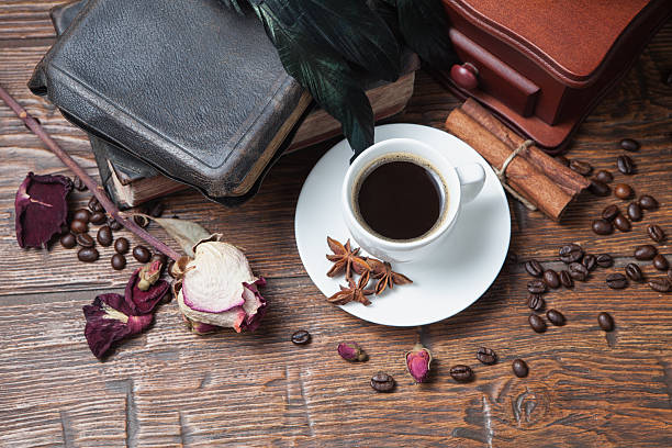 istock Cup of coffee, dry rose and grinder 607609734