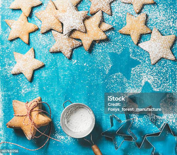 Christmas Gingerbread Cookies With Sugar Powder And Metal Shapes Stock Photo - Download Image Now