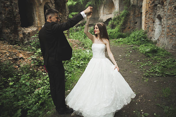 istock Sensual married couple, valentines hugging in front of old slavic 607612408