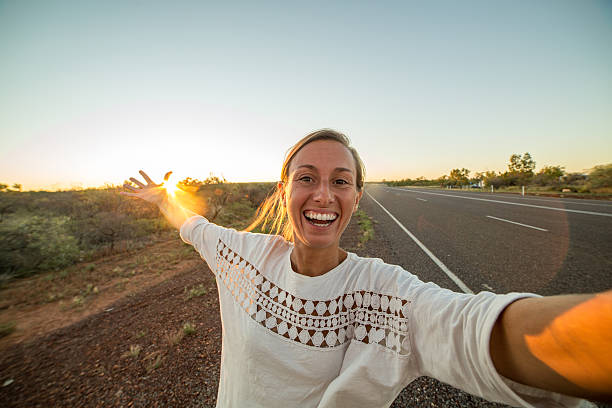 istock Selfie portrait in the outback at sunset 607612668