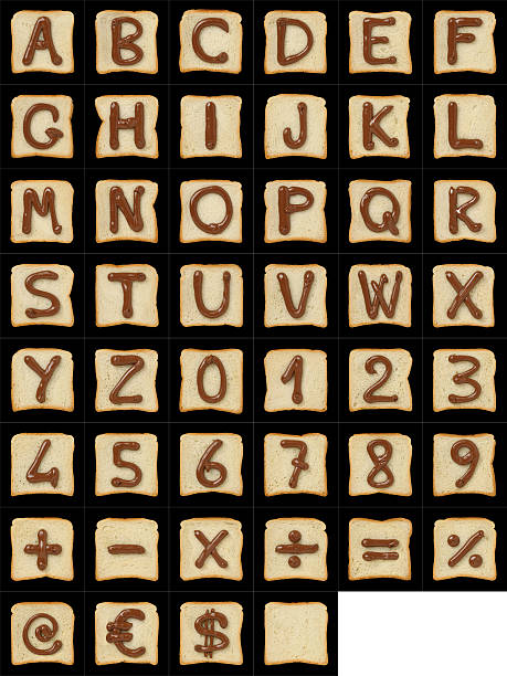 symboles alphanumériques dessinés avec du nutella sur des tranches de pain sur noir - letter j chocolate spread chocolate nutella photos et images de collection