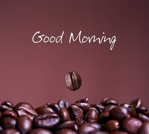 Closeup of coffee beans, good morning text