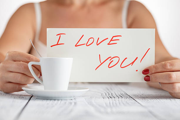 istock woman holding a paper message with the text 607619480