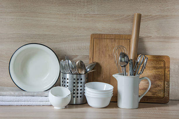 istock Crockery, utensils and other different stuff on wooden table.  Copyspace. 607620696