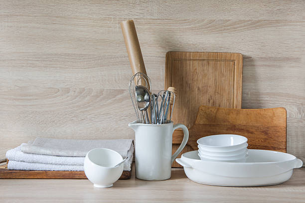 istock Crockery, utensils and other different stuff on wooden table.  Copyspace. 607620790
