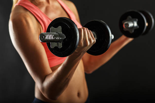 istock Fitness female  with dumbbells 607620878