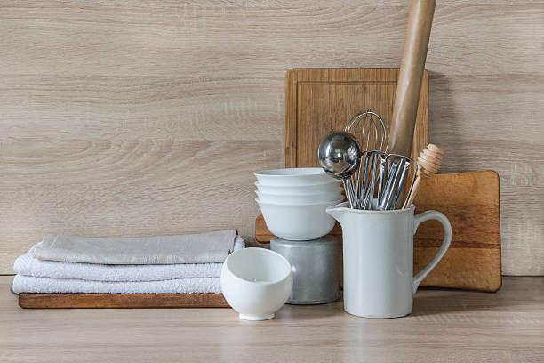 istock Crockery, utensils and other different stuff on wooden table.  Copyspace. 607620898