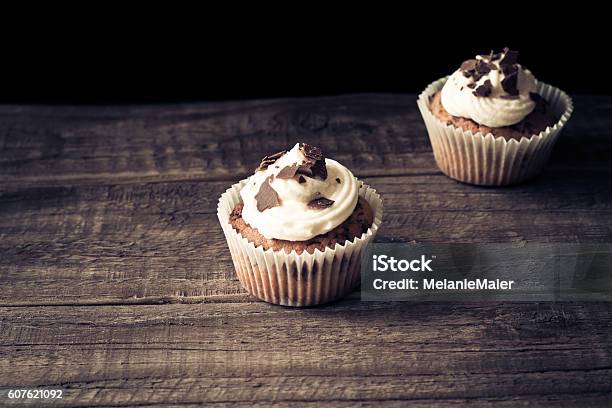 Chocolate Cupcakes On A Wooden Table Stock Photo - Download Image Now - Baked, Baked Pastry Item, Brown