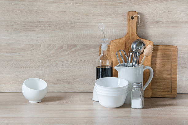 istock Crockery, utensils and other different stuff on wooden table.  Copyspace. 607621412