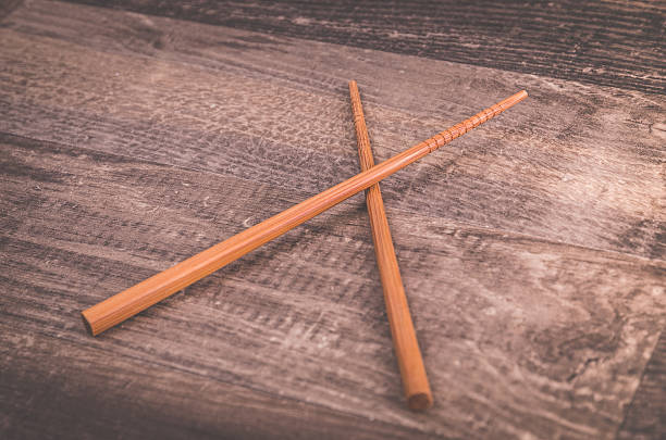 istock Asian chopsticks on wooden table 607622144