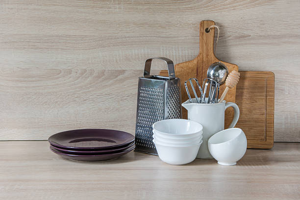 istock Crockery, utensils and other different stuff on wooden table.  Copyspace. 607622150