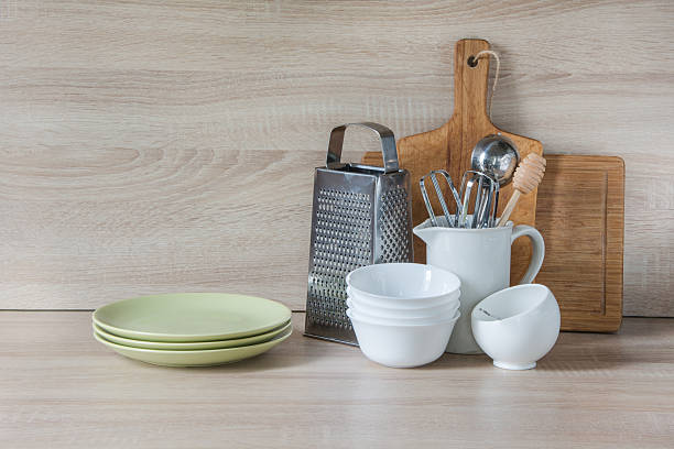 istock Crockery, utensils and other different stuff on wooden table.  Copyspace. 607622270