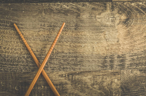 istock Asian chopsticks on wooden table 607622282