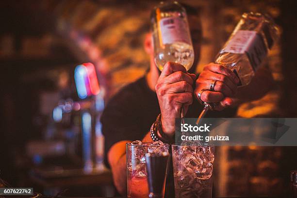 Midsection Of Young Bartender Preparing Cocktails In Nightlife Bar Stock Photo - Download Image Now