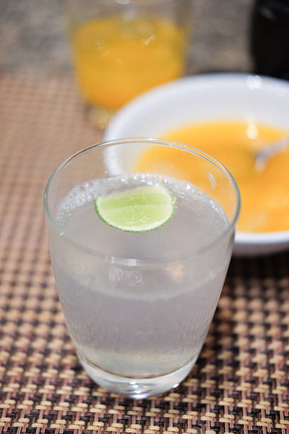 istock Close-up glass of iced lime soda drink 607632964