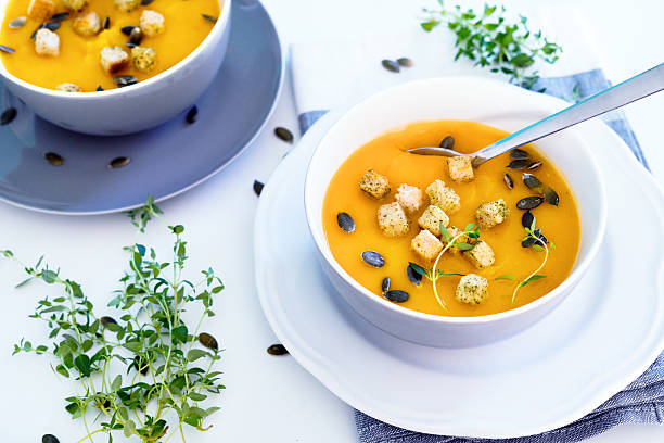 istock Pumpkin soup served with croutons and pumpkin seeds 607642222